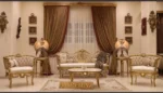 Custom sofa set with carved wood frames and light upholstery